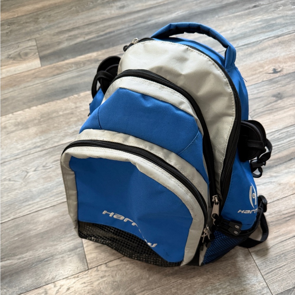 Harrow lacrosse Backpack, blue multi pocket with 2 stick holders great condition